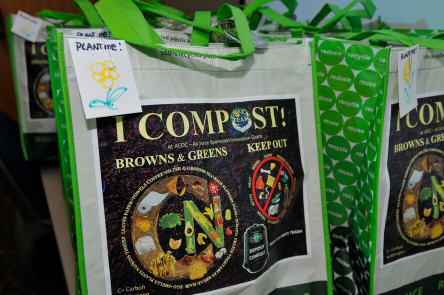 Green Team members received informational composting bags when they volunteered to be captains in the AEDC composting program. The program began last year as part of an Air Force grant. There have been 25 compost bins placed at 11 locations throughout AEDC. (U.S. Air Force photo/Jacqueline Cowan)
