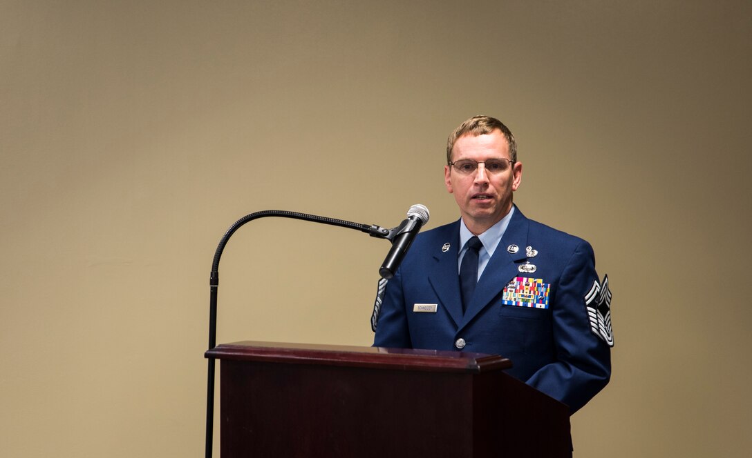 Chief Master Sgt. Carl Schneider, 188th Intelligence Support Squadron superintendent, speaks to the audience April 4, 2016, during his promotion ceremony at Ebbing Air National Guard Base, Fort Smith, Ark. At the ceremony, Schneider emphasized the importance of leadership and mentorship. (U.S. Air National Guard photo by Senior Airman Cody Martin/Released)