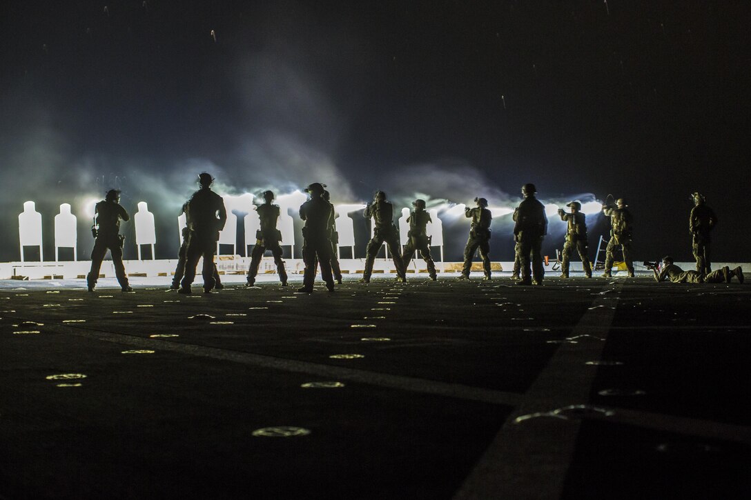 Marines conduct a deck shoot at night during Western Pacific Deployment 16 aboard the USS New Orleans in the Pacific Ocean, April 1, 2016. The Marines are assigned to Maritime Raid Force, 13th Marine Expeditionary Unit. Marine Corps photo by Sgt. Hector de Jesus