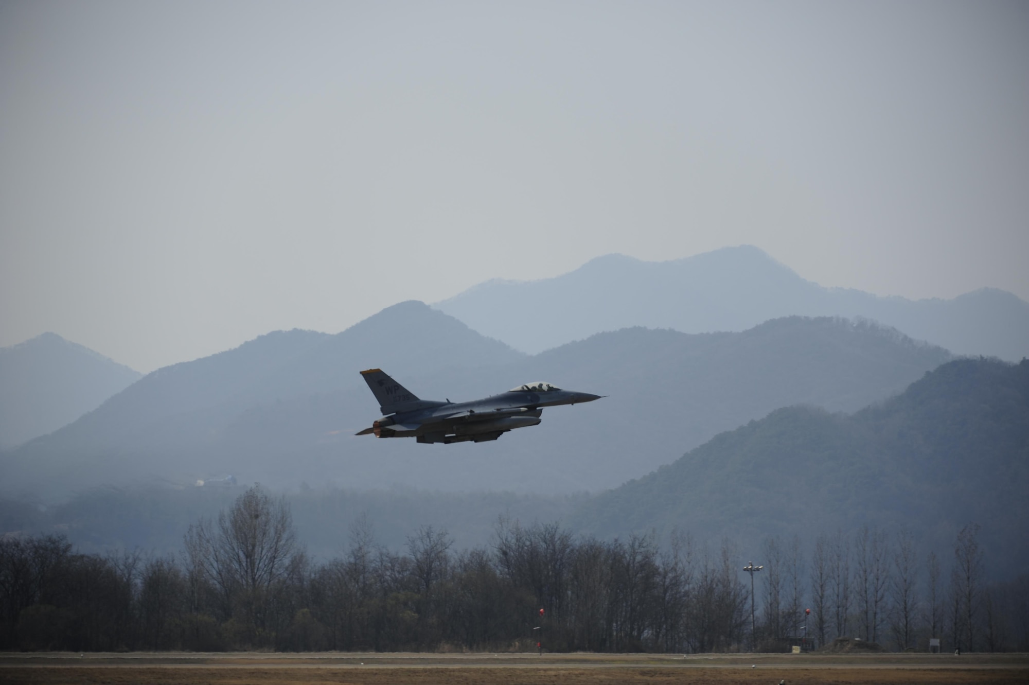 An F-16 Fighting Falcon from the 80th Fighter Squadron takes off during Buddy Wing 16-3 at Jungwon Air Base, Republic of Korea, March 30, 2016. Buddy Wing training, held multiple times a year, polishes the ability of the Republic of Korea and U.S. pilots to train and operate as a combined force. (U.S. Air Force photo by Staff Sgt. Nick Wilson/Released)