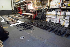 (March 31, 2016) A cache of weapons is assembled on the deck of the guided-missile destroyer USS Gravely (DDG 107). The weapons were seized from a stateless dhow, which was intercepted by the Coastal Patrol ship USS Sirocco (PC 6) on March 28. The illicit cargo included 1,500 AK-47s, 200 RPG launchers, and 21 .50 caliber machine guns. Gravely supported the seizure following the discovery of the weapons by Sirocco's boarding team. This seizure was the third time in recent weeks international naval forces operating in the waters of the Arabian Sea seized a shipment of illicit arms, which the United States assessed, originated in Iran and was likely bound for Houthi insurgents in Yemen. The weapons are now in U.S. custody awaiting final disposition. 