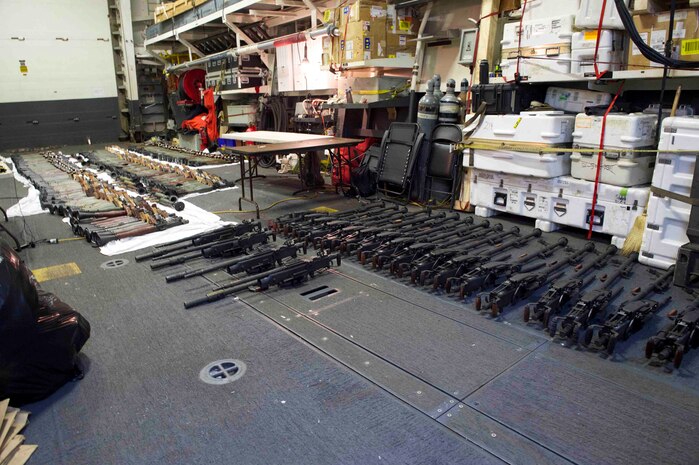 (March 31, 2016) A cache of weapons is assembled on the deck of the guided-missile destroyer USS Gravely (DDG 107). The weapons were seized from a stateless dhow, which was intercepted by the Coastal Patrol ship USS Sirocco (PC 6) on March 28. The illicit cargo included 1,500 AK-47s, 200 RPG launchers, and 21 .50 caliber machine guns. Gravely supported the seizure following the discovery of the weapons by Sirocco's boarding team. This seizure was the third time in recent weeks international naval forces operating in the waters of the Arabian Sea seized a shipment of illicit arms, which the United States assessed, originated in Iran and was likely bound for Houthi insurgents in Yemen. The weapons are now in U.S. custody awaiting final disposition. 