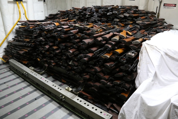 (March 31, 2016) A cache of weapons is assembled on the deck of the guided-missile destroyer USS Gravely (DDG 107). The weapons were seized from a stateless dhow, which was intercepted by the Coastal Patrol ship USS Sirocco (PC 6) on March 28. The illicit cargo included 1,500 AK-47s, 200 RPG launchers, and 21 .50 caliber machine guns. Gravely supported the seizure following the discovery of the weapons by Sirocco's boarding team. This seizure was the third time in recent weeks international naval forces operating in the waters of the Arabian Sea seized a shipment of illicit arms, which the United States assessed, originated in Iran and was likely bound for Houthi insurgents in Yemen. The weapons are now in U.S. custody awaiting final disposition.