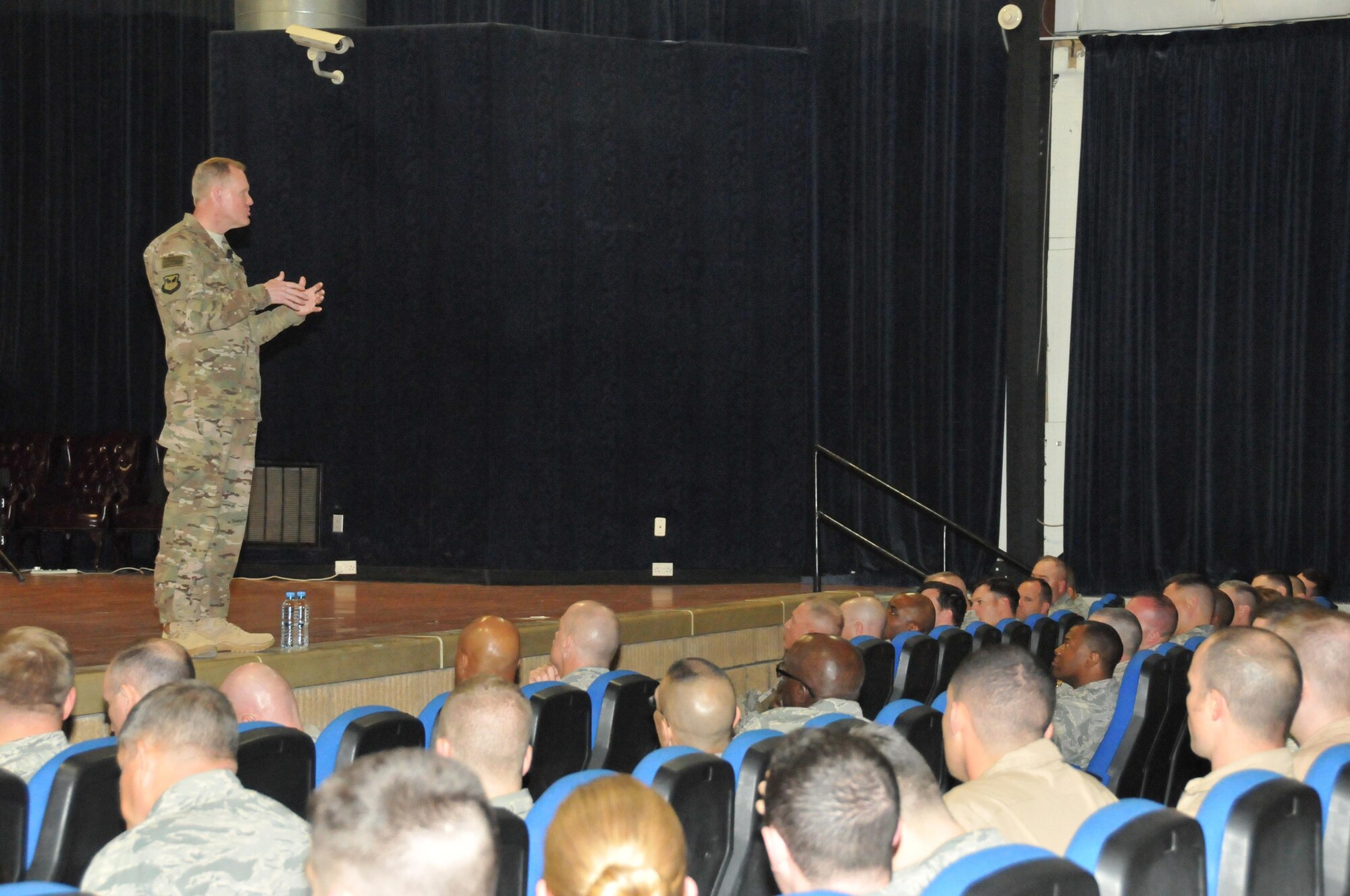 Chief Master Sgt. of the Air Force, James Cody, speaks to more than 400 Airmen during an all call April 4 at Al Udeid Air Base, Qatar. Cody addressed questions from various military personnel to include professional military education, enlisted performance reports and basic military training concerns. (U.S. Air Force photo by Tech. Sgt. Terrica Y. Jones/Released)