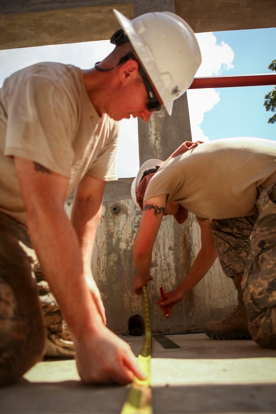 Airmen measure specific distances to install pipes during Exercise Balikatan 2016 at Jaena Norte Elementary School in Capiz, Philippines, April 2, 2016. Marine Corps photo by Cpl. Hilda M. Becerra