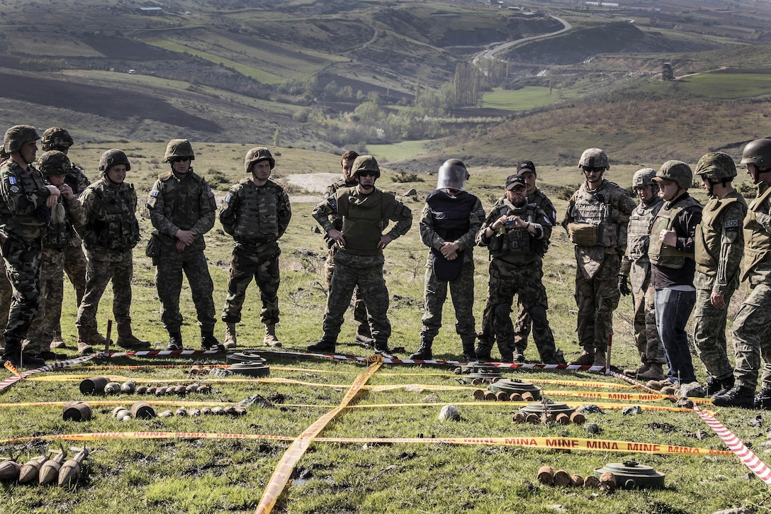 U.S., Kosovar, Moldovan, Ukrainian, and Swiss soldiers receive a safety and mission brief before participating in a joint mine clearing operation at Orahovac Demolition Range in Kosovo, April 4, 2016. Army photo by Staff Sgt. Thomas Duval