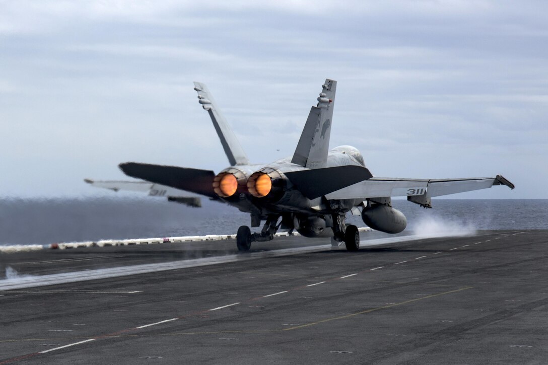 An F/A-18C Hornet attached to Strike Fighter Squadron 131 launches from the flight deck of the aircraft carrier USS Dwight D. Eisenhower in the Atlantic Ocean, March 24, 2016. Navy photo by Petty Officer 3rd Class Anderson W. Branch