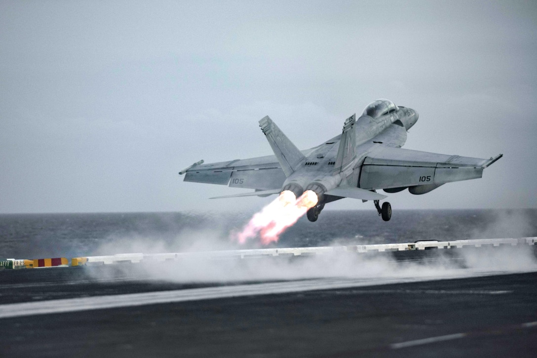An F/A-18F Super Hornet assigned to Strike Fighter Squadron 32 takes off from the flight deck of the aircraft carrier USS Dwight D. Eisenhower in the Atlantic Ocean, March 24, 2016. Navy photo by Petty Officer 3rd Class Jameson E. Lynch 