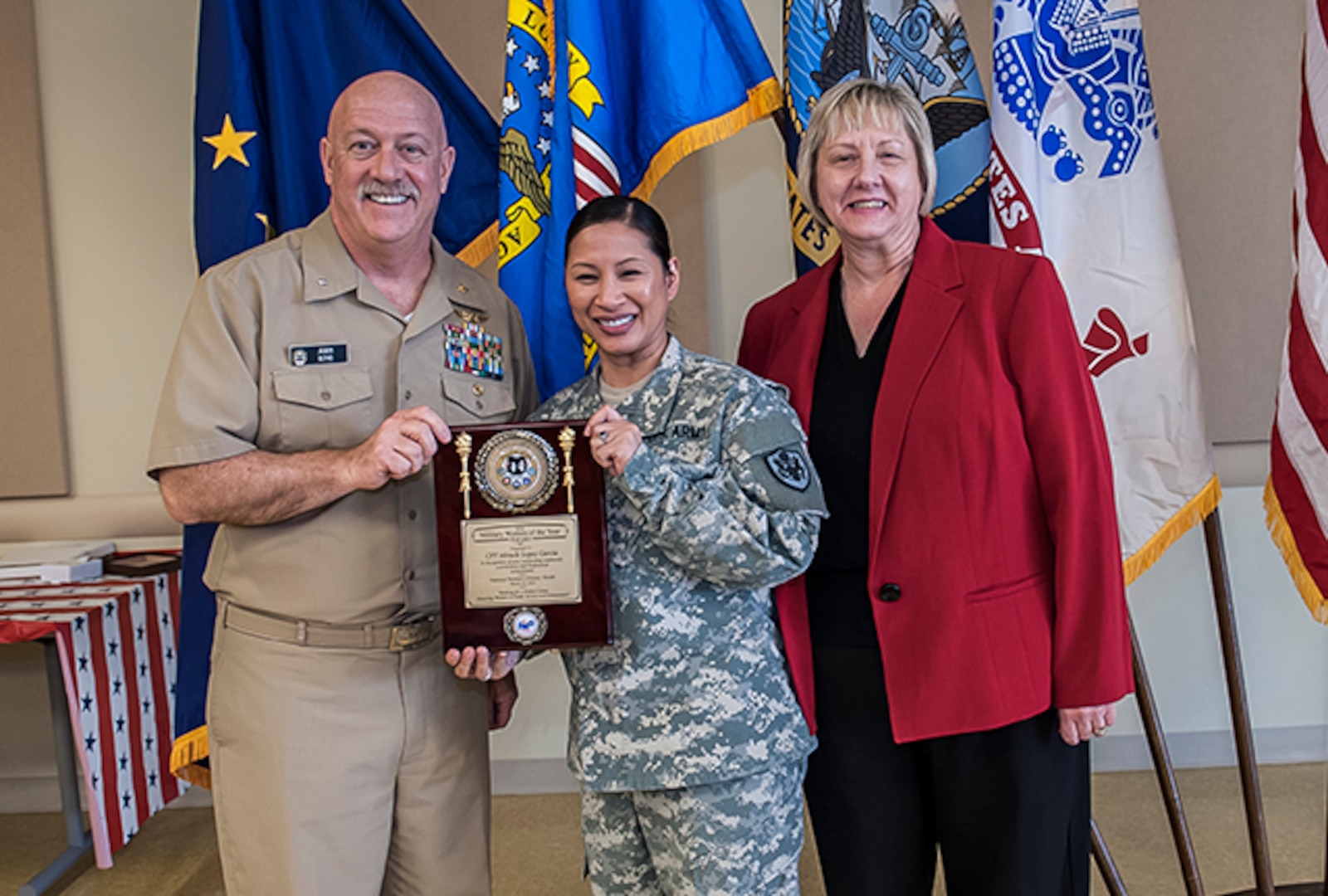 The 2016 Military Woman of the Year was Army Capt. Miracle Lopez Garcia. Garcia works as a price pending team supervisor in the Land Supplier Operations Directorate. She was given the award during Defense Supply Center Columbus’ annual Women's History Month Luncheon March 23 at the Armed Forces Reserve Center on DSCC. Pictured with Garcia is Navy Rear Adm. John King, Land and Maritime commander, and Brenda Galowyn, DFAS. 