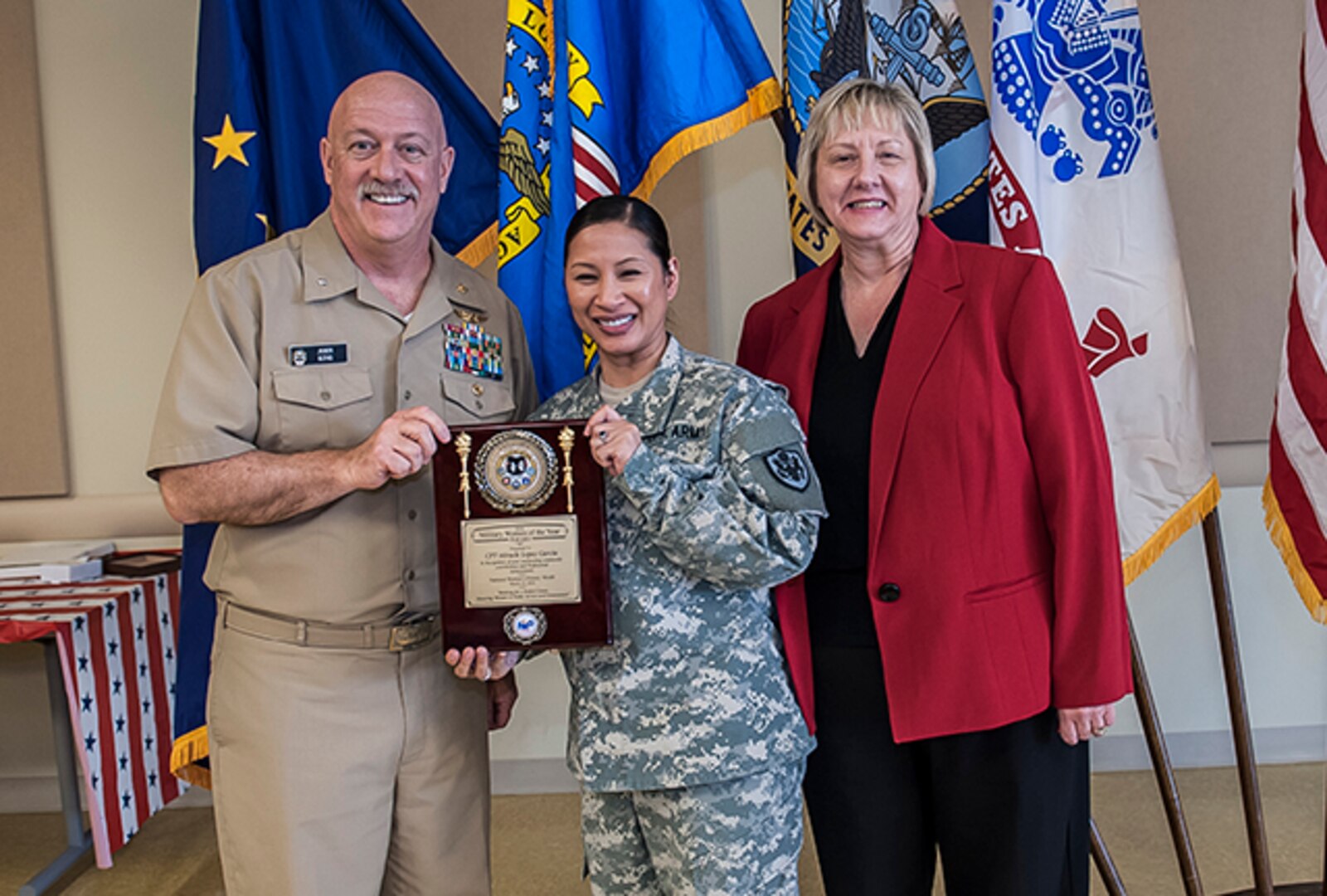 The 2016 Military Woman of the Year was Army Capt. Miracle Lopez Garcia. Garcia works as a price pending team supervisor in the Land Supplier Operations Directorate. She was given the award during Defense Supply Center Columbus’ annual Women's History Month Luncheon March 23 at the Armed Forces Reserve Center on DSCC. Pictured with Garcia is Navy Rear Adm. John King, Land and Maritime commander, and Brenda Galowyn, DFAS. 