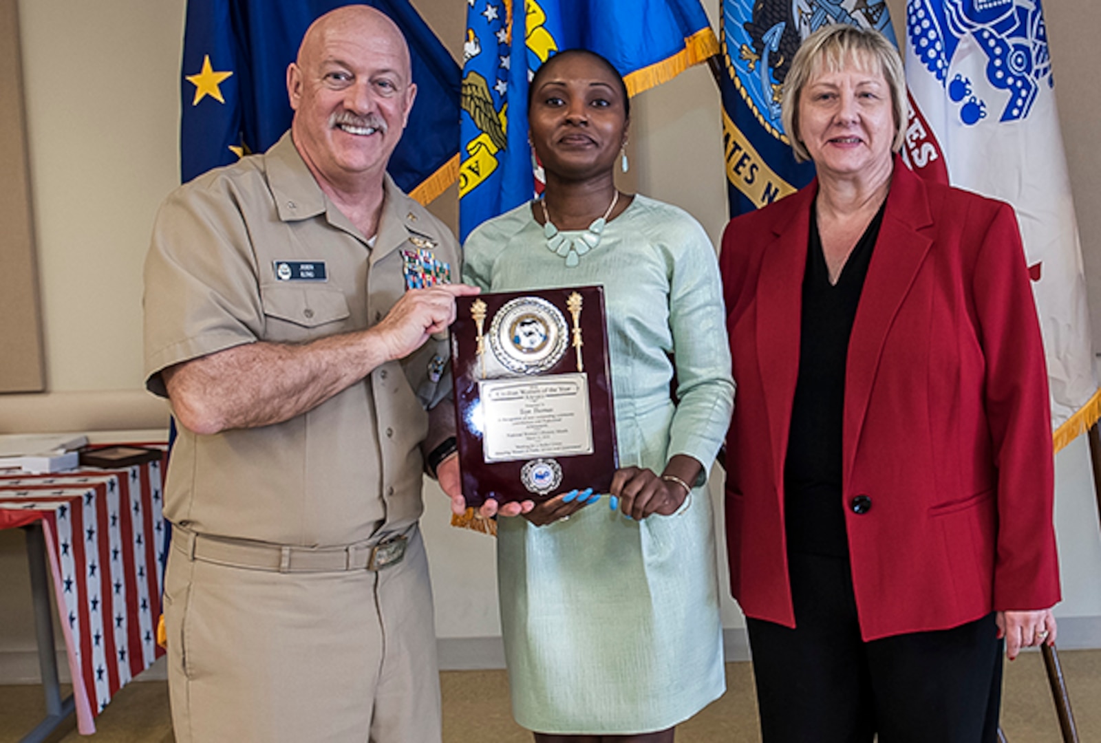 The 2016 Civilian Woman of the Year was Toye Thomas, an internal review evaluator with Land and Maritime. She was given the award during Defense Supply Center Columbus’ annual Women's History Month Luncheon March 23 at the Armed Forces Reserve Center on DSCC. Pictured with Garcia is Navy Rear Adm. John King, Land and Maritime commander, and Brenda Galowin, DFAS. 