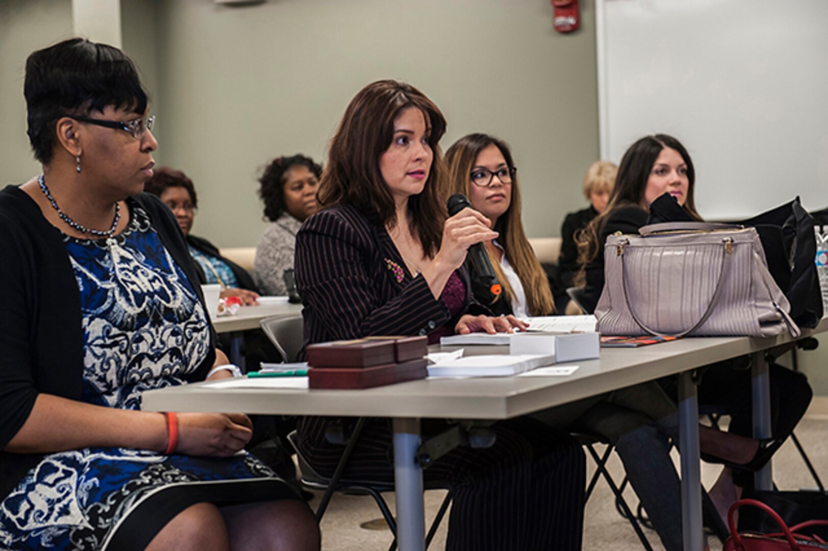 An attendee asks a question to a panelist at Defense Supply Center Columbus’ Women’s Leadership Summit March 23 in the Armed Forces Reserve Center (Building 2). The summit offered two workshops and a panel of four extraordinary women with diverse backgrounds in military, government and public service, sharing their career experiences to enable participants to enhance their leadership skills.  