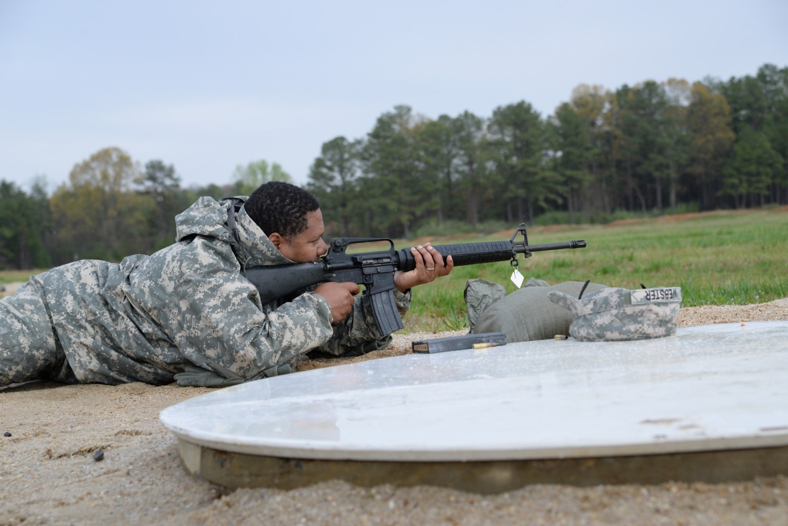 Capt. Rowan Webster, DLA Joint Contingency Acquisition Support Office, fires an M16 Rifle during weapons training April 2 at Fort A.P. Hill, Va.