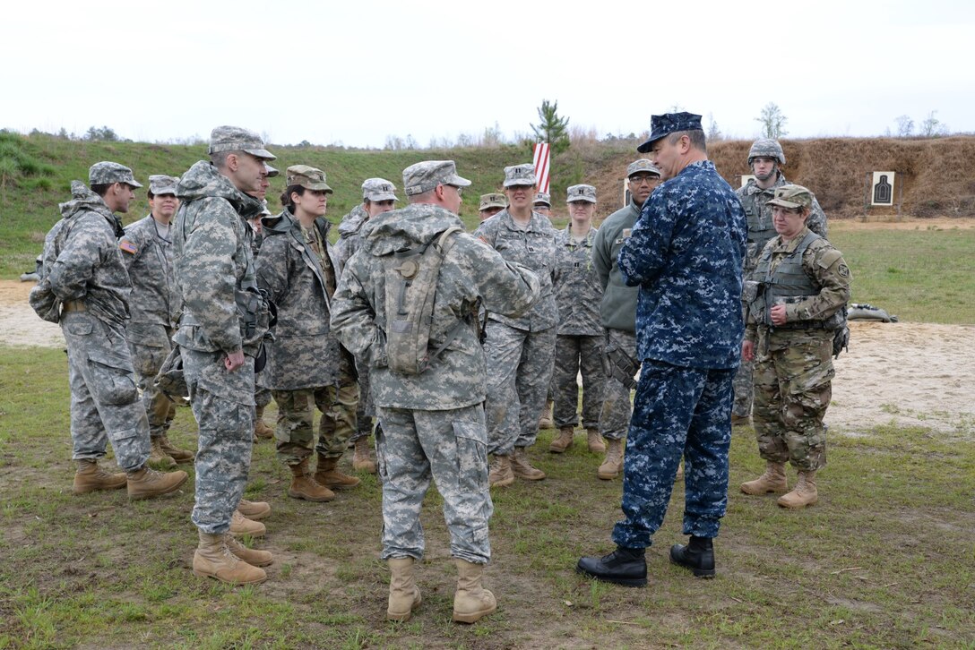 DLA JRF Director, Rear Adm. Ron MacLaren, talks to participants during weapons training at Fort A.P. Hill, Va., April 2. The goal was to gain familiarization with the weapons for combat readiness and to qualify for deployments.