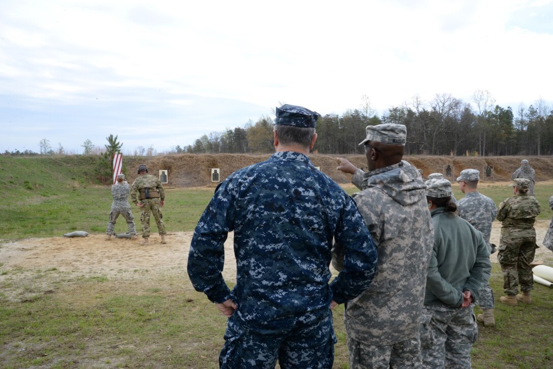 DLA JRF Director, Rear Adm. Ron MacLaren, talks to participants during weapons training at Fort A.P. Hill, Va., April 2. The goal was to gain familiarization with the weapons for combat readiness and to qualify for deployments.