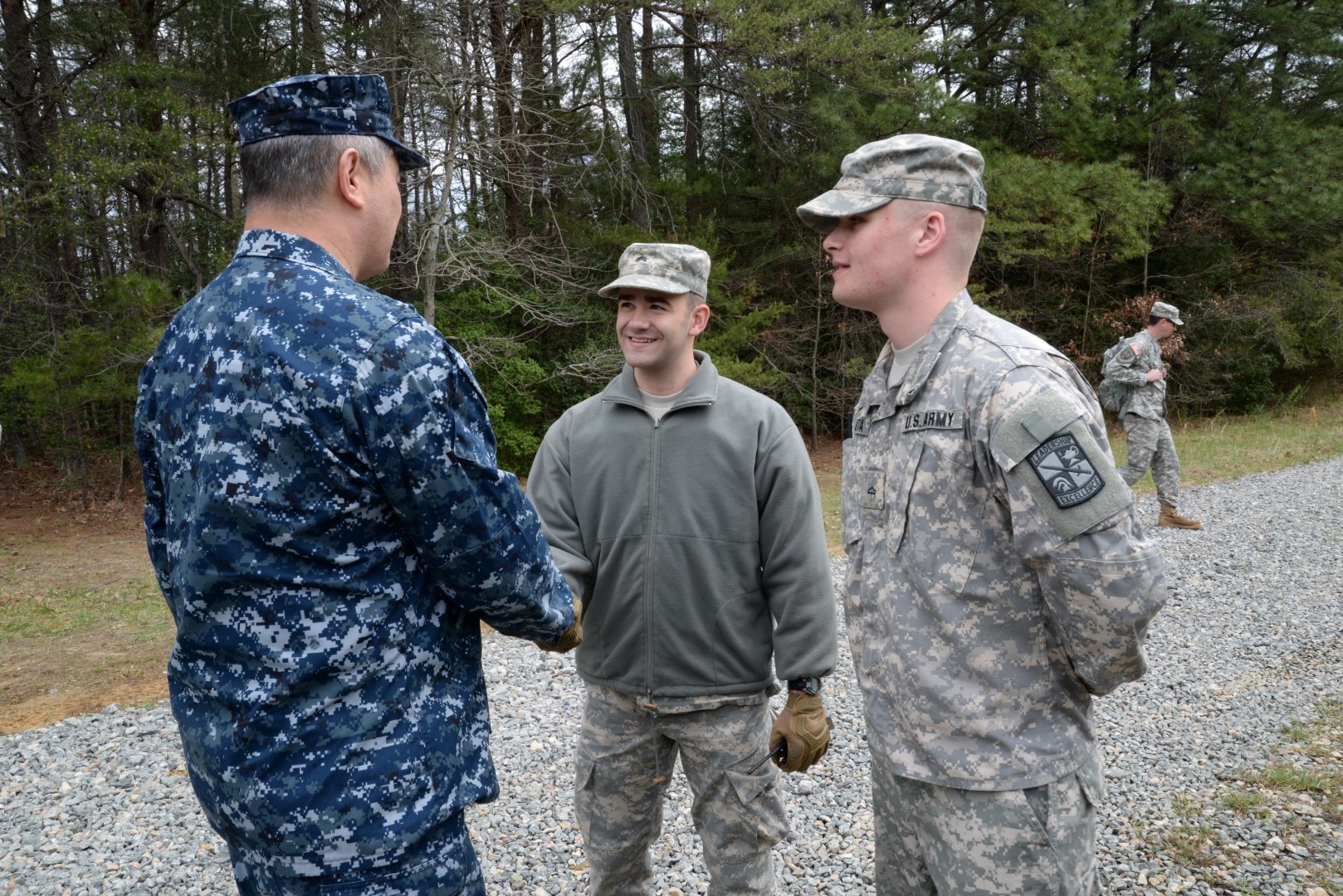 DLA JRF Director, Rear Adm. Ron MacLaren, talks to ROTC Cadets during weapons training at Fort A.P. Hill, Va., April 2. The goal of the two day training was to gain familiarization with the weapons for combat readiness and to qualify for deployments.