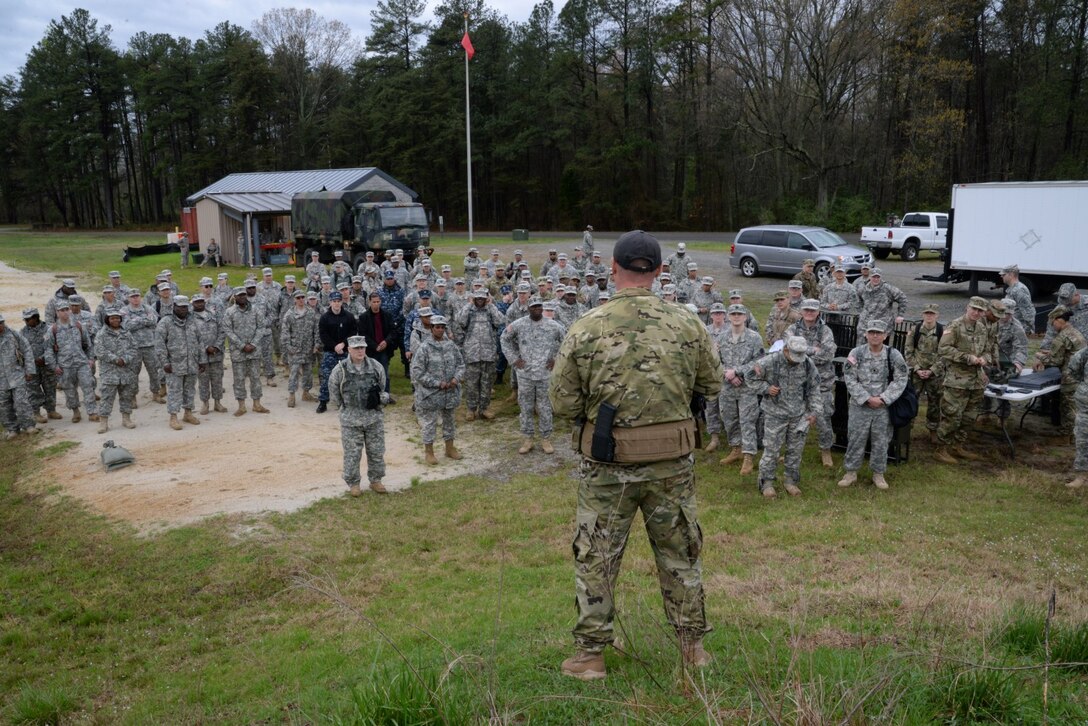 1st Sgt. Tony McCarty briefs safety instructions to DLA JRF members and other soldiers prior to firing weapons April 1 at Fort A.P. Hill, Va.