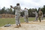 DLA JRF members fire M9 pistols during weapons training April 1 at Fort A.P. Hill, Va. The goal was to gain familiarization with the weapons for combat readiness and to qualify for deployments.