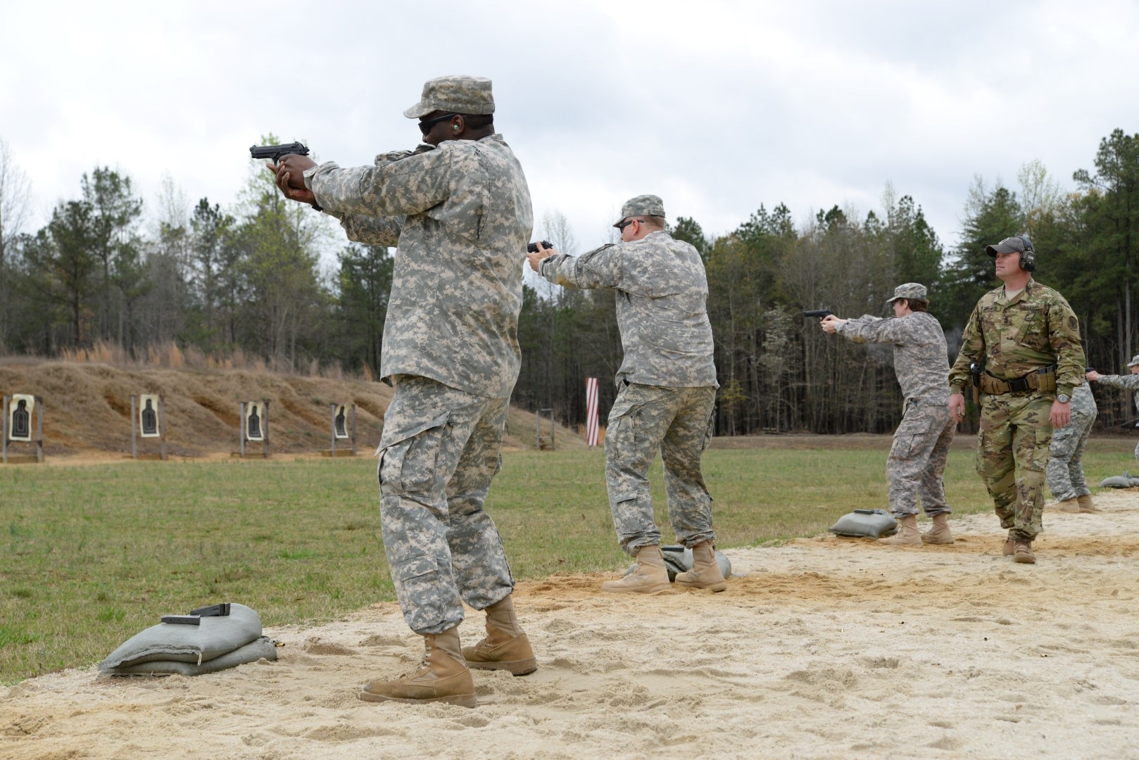 DLA JRF members fire M9 pistols during weapons training April 1 at Fort A.P. Hill, Va. The goal was to gain familiarization with the weapons for combat readiness and to qualify for deployments.