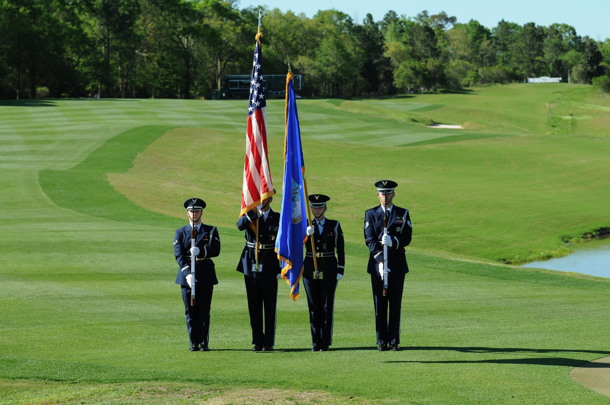 Members of the Keesler Honor Guard post the colors during the signing of the national anthem during the Mississippi Gulf Resort Classic closing ceremonies at the Fallen Oak Golf Course April 3, 2016. Col. Michele Edmondson, 81st Training Wing commander, and Keesler Airmen also participated in the festivities. (U.S. Air Force photo by Kemberly Groue)