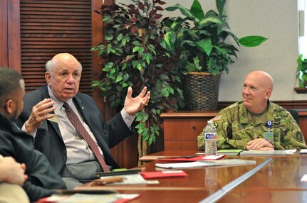 Olin Brewster, an Army Reserve ambassador for the 63rd Regional Support Command, (center) briefs staff delegate members from Washington D.C., as Brig. Gen. Pete Bosse, director, Army Reserve Engagement Cell, U.S. Army North, looks on, March 28, Fort Sam Houston, Texas. The brief was part of a staff delegate tour of Army Reserve facilities throughout Central Texas.