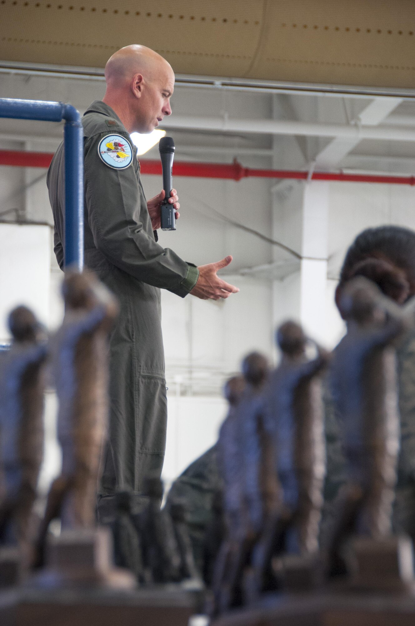 Maj. Dan Rooney speaks at the 2015 Maintenance Professional Awards Banquet in the hangar here, April 2. Rooney is a 301st Fighter Squadron pilot at Tyndall Air Force Base, Fla., and founder of the Folds of Honor Foundation. More than 250 Airmen and family members from the 301st Maintenance Group and 355th Fighter Squadron gathered to recognize award winner's contributions to the Air Force mission.(U.S. Air Force photos by Senior Airman Ben Calantas)