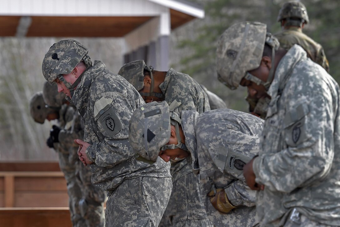 Paratroopers rehearse jump procedures before a night airborne operation at Joint Base Elmendorf-Richardson, Alaska, March 31, 2016. Air Force photo by Alejandro Pena