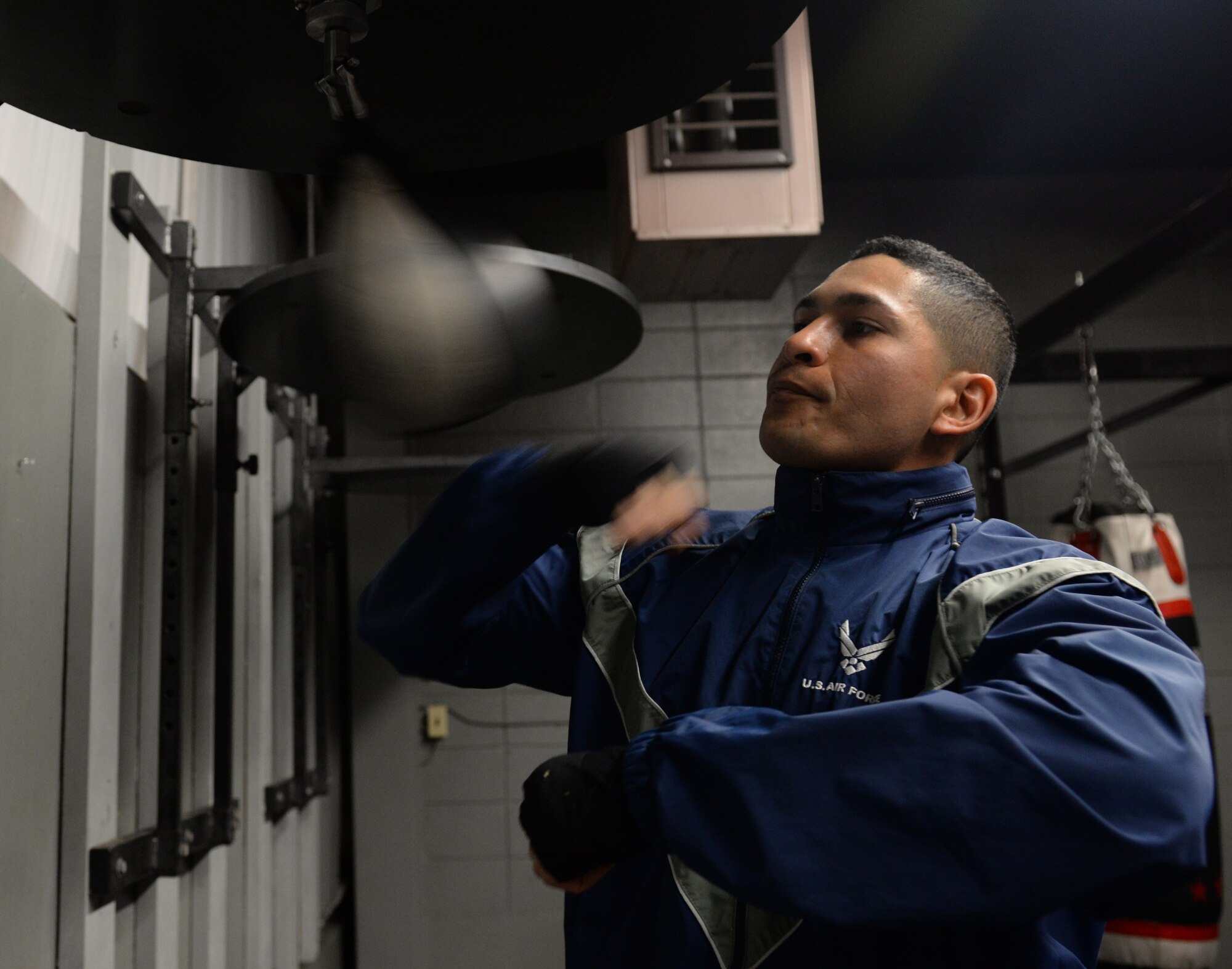 First Lt. Christian Torres, a 81st Comptroller Squadron deputy project officer, hits a speed bag at the Triangle Gym on March 3, 2016, at Keesler Air Force Base, Miss. Torres boxed recreationally and had the opportunity to become a professional boxer, however, due to family needs he chose his current path in the Air Force. (U.S. Air Force Photo/Airman 1st Class Travis Beihl)