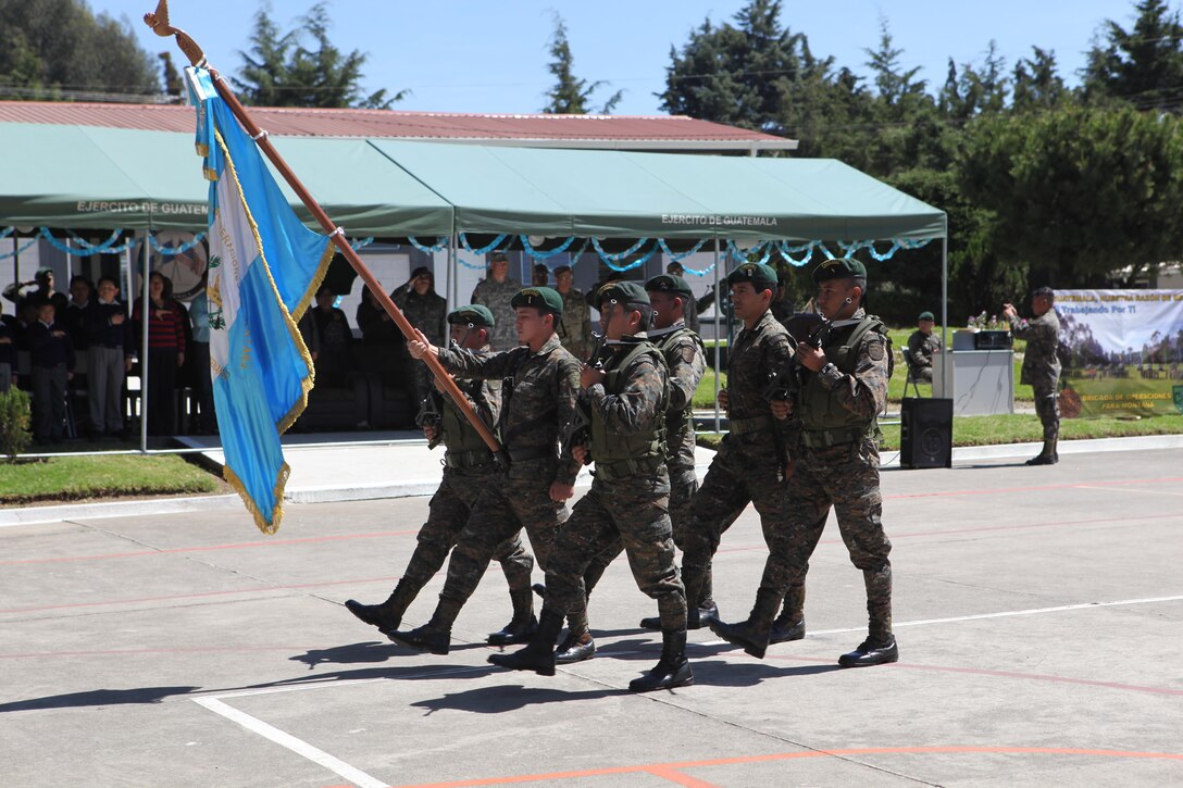 Guatemalan Army color guard march off after the celebration for Guatemala's republic day at San Marcos, April 4th, 2016. Task Force Red Wolf and Army South conducts Humanitarian Civil Assistance Training to include tactical level construction projects and Medical Readiness Training Exercises providing medical access and building schools in Guatemala with the Guatemalan Government and non-government agencies from 05MAR16 to 18JUN16 in order to improve the mission readiness of US Forces and to provide a lasting benefit to the people of Guatemala. (U.S. Army photo by Sgt. Prosper Ndow/Released)