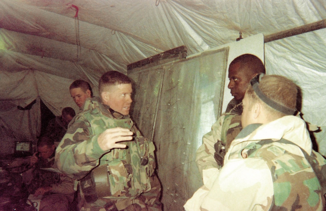 Army Col. David G. Perkins and Army Brig. Gen. Lloyd J. Austin III consult in the 3rd Infantry Division's 2nd Brigade tactical operations center in Iraq in April 2003. Both officers would go on to wear four stars. Army photo by Master Sgt. Demetrius Johnson
