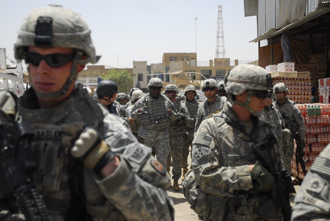 Army Lt. Gen. Lloyd J. Austin, commanding general of Multinational Corps Iraq, conducts a battlefield circulation at a market in Baghdad, March 28, 2006. Army photo by Jason R. Krawczyk