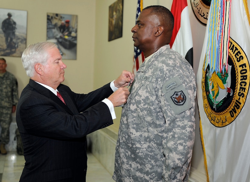 Defense Secretary Robert M. Gates, left, presents a fourth star to Army Gen. Lloyd J. Austin III at Al Faw Palace at Camp Victory in Baghdad, Sept. 1, 2010. Austin assumed command of U.S. Forces Iraq during a transfer-of-command ceremony at the base. DoD photo by Air Force Master Sgt. Jerry Morrison 