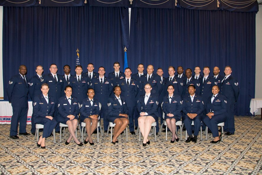 The 512th Airlift Wing's newest staff sergeants pose for a group photo following a noncommissioned officer induction ceremony held here at Dover Air Force Base, Delaware, April 2, 2016. (U.S. Air Force photo/Tech. Sgt. Mercedes Crossland) 