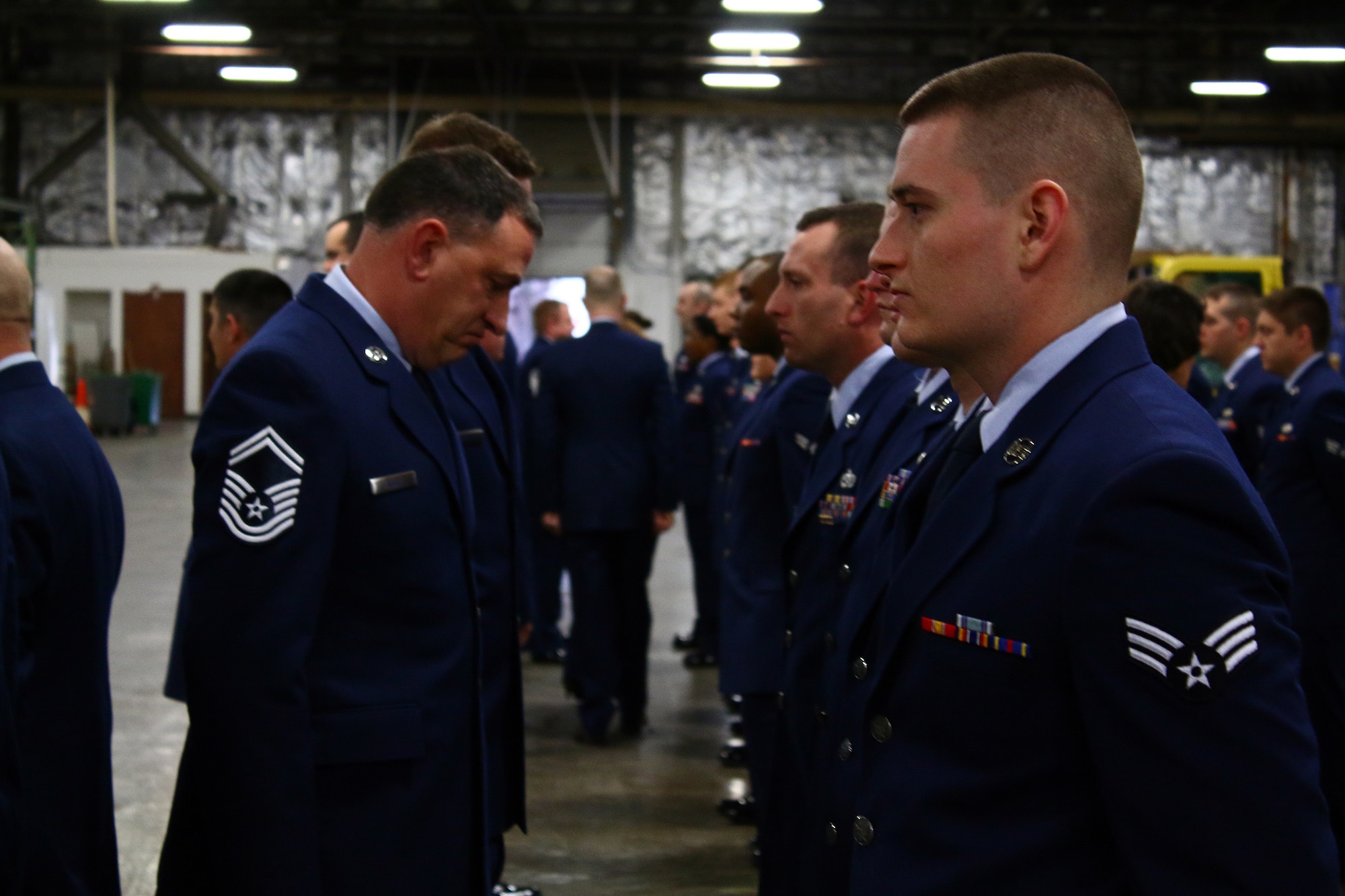 Senior Master Sgt. Rose Gregory Rose, 445th Logistics Readiness Squadron vehicle maintenance/operations flight superintendent, inspects the uniform and appearance of each 445th LRS Airmen during an open ranks inspection held as part of the March 6, 2016 unit training assembly. 