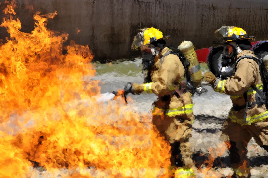 Airmen train to extinguish an aircraft fire at the 165th Airlift Wing's Regional Fire Training Facility in Savannah, Ga., April 4, 2016. The airmen conducted a joint training exercises to maintain operational readiness. The firefighters are assigned to the Connecticut, Maine, New Jersey, Rhode Island and Vermont Air National Guards. Air National Guard photo by Tech. Sgt. Andrew J. Merlock