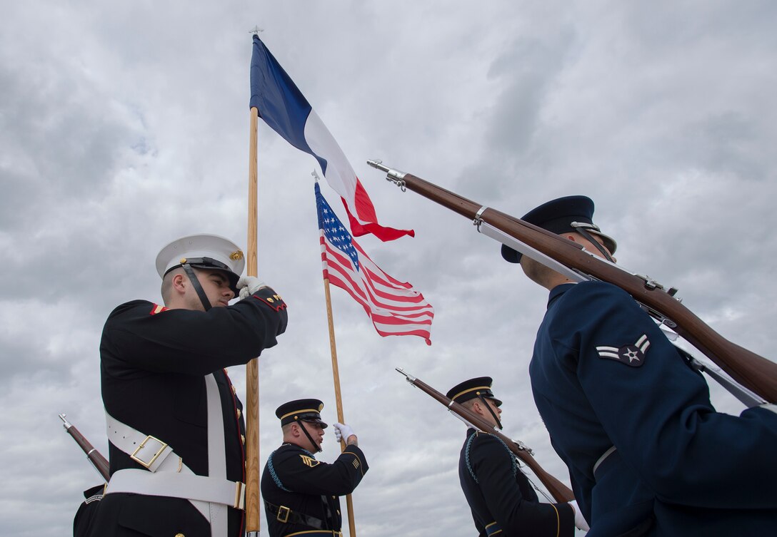 As part of a joint color guard, Marines from Marine Barracks Washington, D.C.,  prepare for the French President’s arrival on the Joint Base Andrew’s flightline, March 31, 2016. More than 20 countries are scheduled to arrive for the 2016 Nuclear Security Summit held in Washington, D.C. The summit provides a forum for leaders to reinforce commitments to securing nuclear materials. (U.S. Air Force photo Senior Airman Nesha Humes)