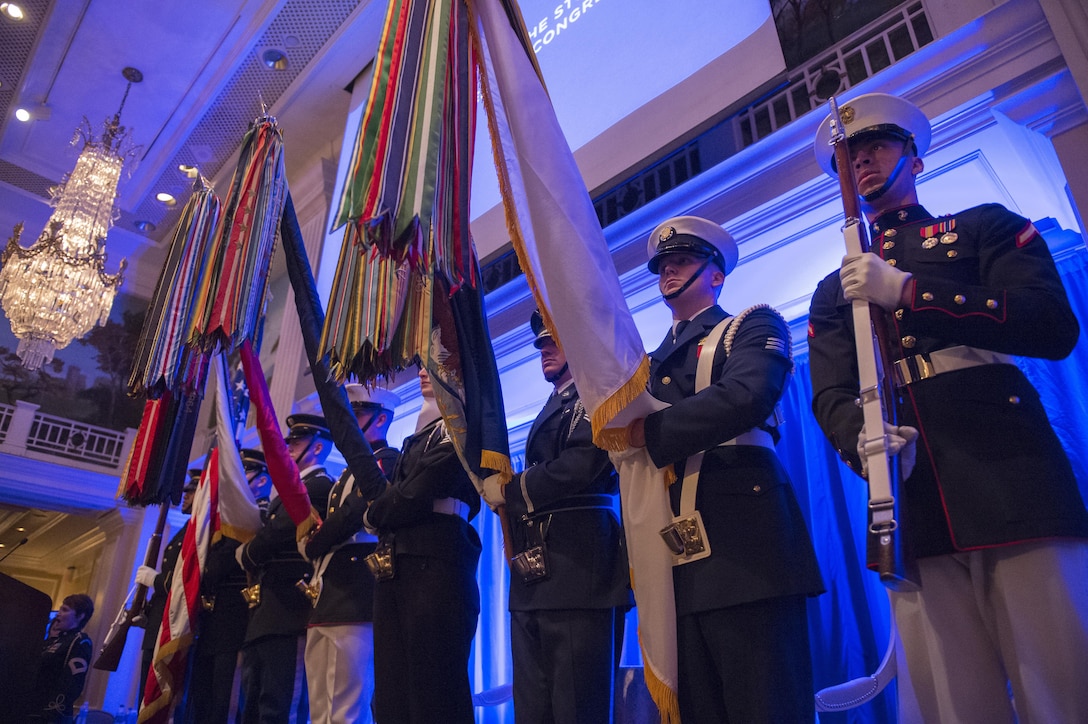 A joint color guard, consisting of Marines from Marine Barracks Washington, D.C., presents the colors during the Study of the Presidency and Congress Eisenhower Award dinner in Washington D.C., where Secretary of Defense Ash Carter was awarded the Eisenhower Award for leadership in national security affairs March 23, 2016. (DoD photo by Senior Master Sgt. Adrian Cadiz)(Released)