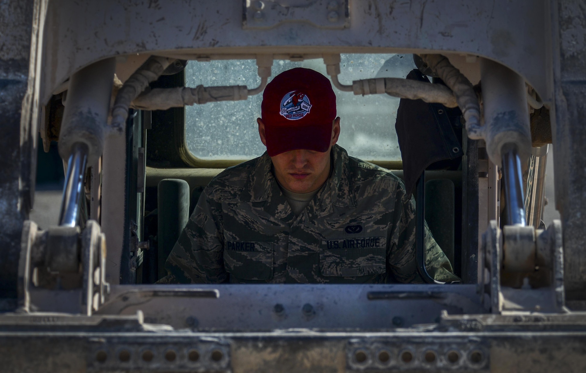 Airman 1st Class Joshua Parker, 555th Red Horse Squadron heavy equipment operator, uses a loader to cover the lightning protection rods for the new firehouse at Nellis Air Force Base, Nev., April 2, 2016. In accomplishing what is needed, the 555th RHS has had an integral part in constructing the new firehouse on base. (U.S. Air Force photo by Airman 1st Class Kevin Tanenbaum)