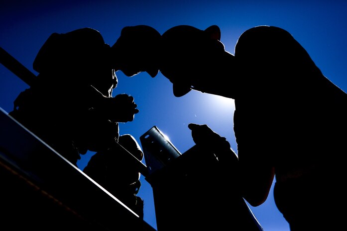 Airmen, assigned to the 555th Red Horse Squadron, lift the beams to construct the roof for the new firehouse at Nellis Air Force Base, Nev., April 2, 2016. With this type of training available, these Airmen learn and serve a pivotal role in the total force of the Air Force. (U.S. Air Force photo by Airman 1st Class Kevin Tanenbaum)