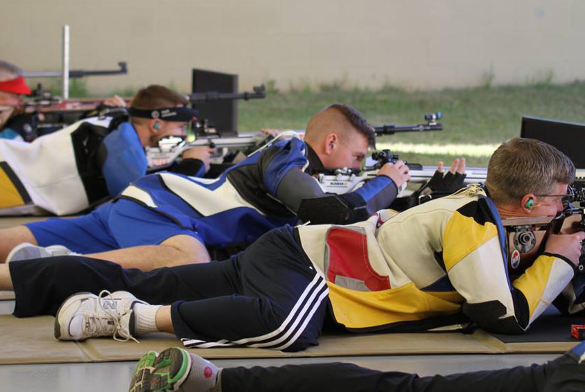 David Higgins (center), a U.S. Air Force Academy Rifle Team member, is flanked by Olympian Matt Emmons on his left and Olympian Eric Uptagrafft on his right. (Courtesy photo)

