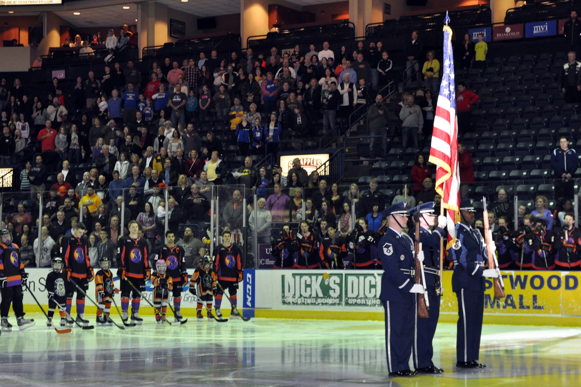 The 910th Airlift Wing Honor Guard presents the colors during pre-game festivities for a Youngstown Phantoms hockey game at the Covelli Centre here, April 2, 2016. A large group of Citizen Airmen, based at nearby Youngstown Air Reserve Station, Ohio, participated in YARS Night Out activities before and during the game. The Phantoms, a member of the United States Hockey League, defeated the Omaha Lancers 4-1 in front of a home ice crowd of more than 3000 fans. (U.S. Air Force photo/Master Sgt. Bob Barko Jr.)
