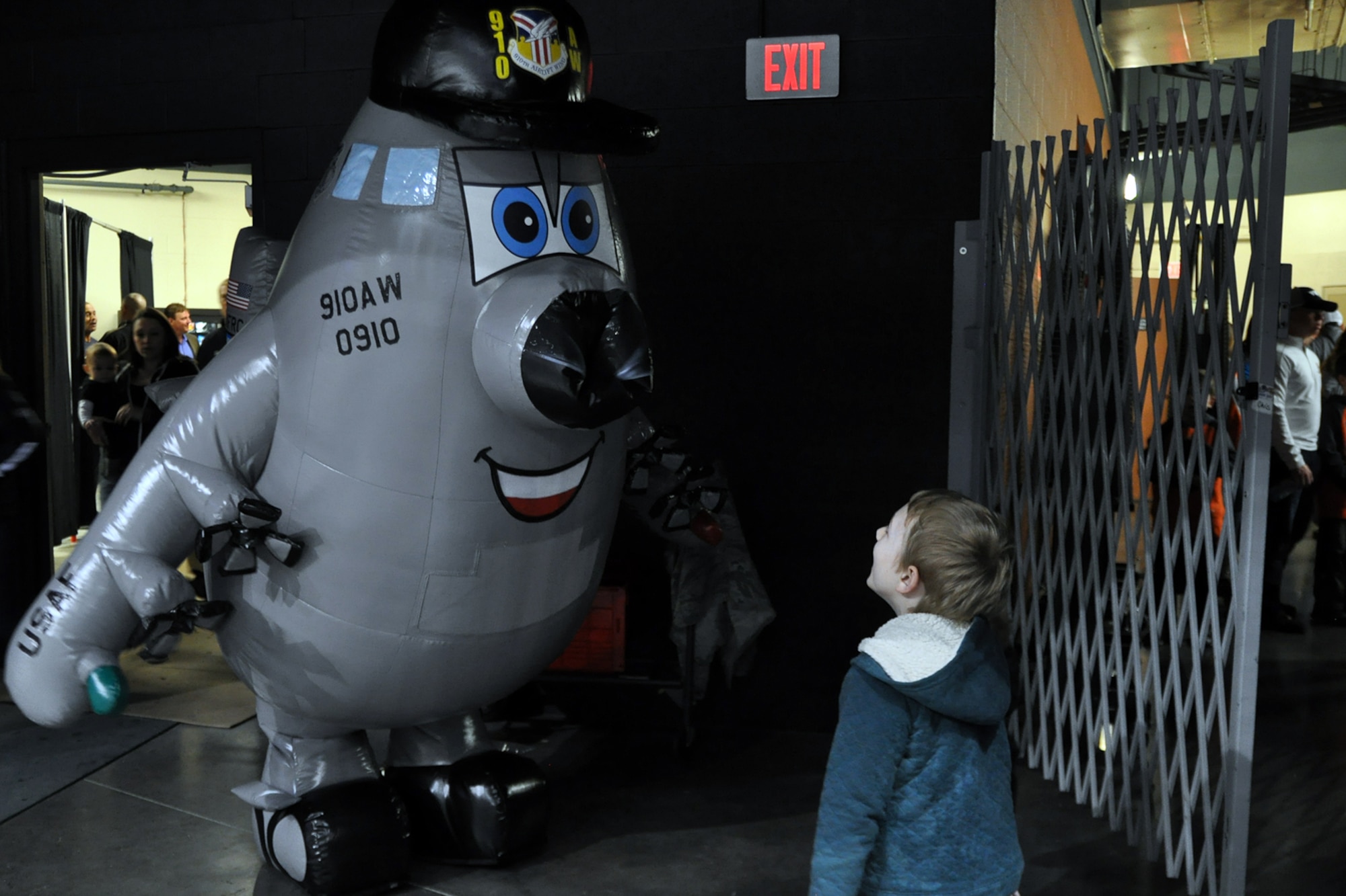 Winger, the new mascot of the 910th Airlift Wing, greets a young hockey fan at the conclusion of a Youngstown Phantoms hockey game at the Covelli Centre here, April 2, 2016. A group of Citizen Airmen, based at nearby Youngstown Air Reserve Station, Ohio, participated in YARS Night Out activities before and during the game. The Phantoms, a member of the United States Hockey League, defeated the Omaha Lancers 4-1 in front of a home ice crowd of more than 3000 fans. The custom designed inflatable Winger mascot, created in the U.S. by a company based in Omaha, Nebraska and sponsored by the Youngstown Air Reserve Base Community Council, is based on a 910th Airlift Wing Public Affairs cartoon which has been featured in more than 50 individual illustrations appearing in various wing publications and on the YARS website since 2007. Area residents can keep an eye out for Winger at upcoming base community events and out and about anywhere in the Mahoning Valley. (Courtesy Photo/Deana Barko)