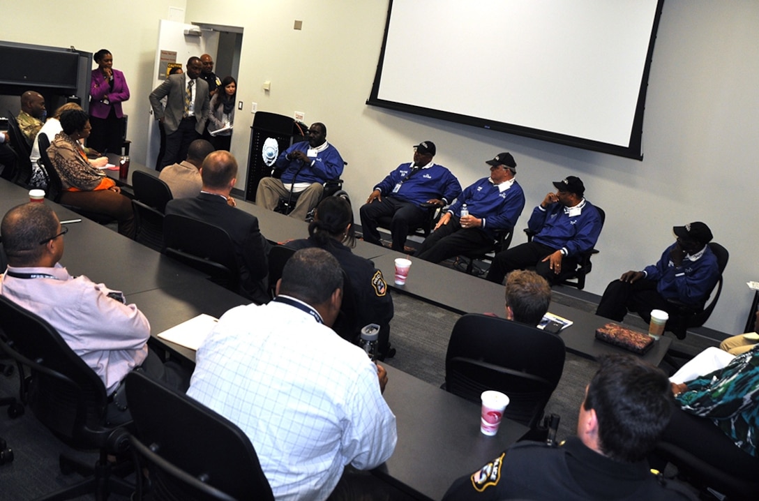 Players from the 1971 T.C. Williams High School Titans football team, featured in 'Remember the Titans,' gave a leadership presentation at the HQC March 31. The players, in blue jackets, are (from left) Julius Campbell, Wayne Sanders, Michael Lynch, Rufus Littlejohn and Darryl Stanton.