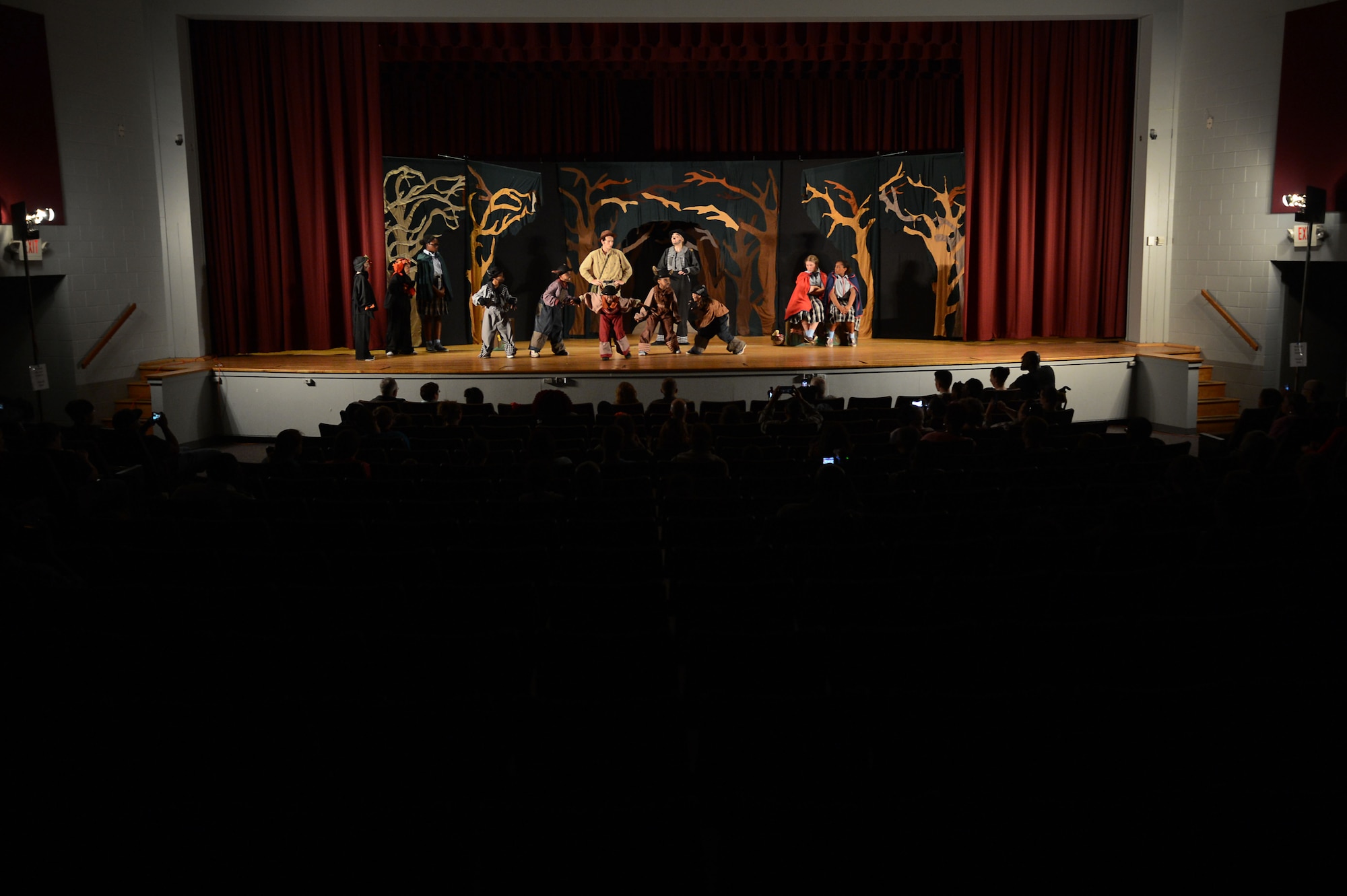 Team Shaw children perform the Missoula Children’s Theatre production of Red Riding Hood in front of family members and friends at the Shaw Theater at Shaw Air Force Base, S.C., April 1, 2016. The Missoula Children’s Theatre is a traveling performing arts workshop for children ages 5-18 that holds auditions for, casts, rehearses, and performs a full-length play in under six days. (U.S. Air Force photo by Senior Airman Zade Vadnais)