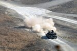 RODRIGUEZ LIVE FIRE COMPLEX, Republic of Korea (April 1, 2016) - A M1A2 Abrams main battle tank crew from Company D, 2nd Battalion, 5th Cavalry Regiment, 1st Armored Brigade Combat Team, 1st Cavalry Division, engages a target during a Table IV tank crew proficiency course.  Table IV is a basic qualification table for tanks crews and is designed to evaluate the crew's ability to engage stationary and moving targets. The battalion is conducting a month-long gunnery at the live fire complex from March 22 to April 24. 