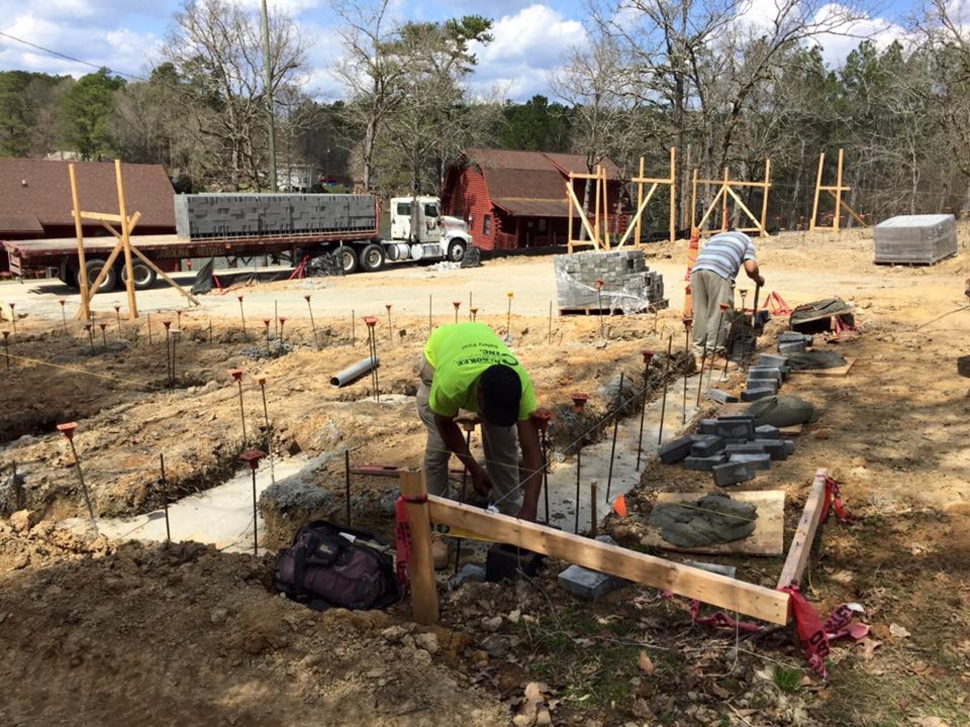 Construction workers lay the foundation for two new two-story, eight-person cabins at the 20th Force Support Squadron’s Wateree Recreation Area at Lake Wateree, S.C., March 14, 2016. To pay for the construction, the 20th FSS used savings collected from the Beautify Wateree Days, annual events where hundreds of volunteers gather at Wateree Recreation Area to clean up the 19-acre property. (Courtesy photo)