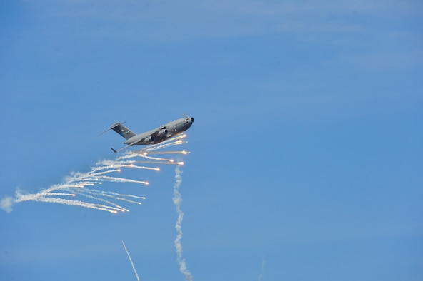 A C-17A Globemaster III from Dover Air Force Base, Del., expends countermeasure flares to defeat a simulated surface-to-air missile shot from a Man-Portable Aircraft Survivability Trainer system during a training mission March 24, 2016, at the Bollen Live-Fire Range Complex on Fort Indiantown Gap, Pa. A total of 240 flares were expended from the aircraft during the training mission. (U.S. Air Force photo/Senior Airman William Johnson)