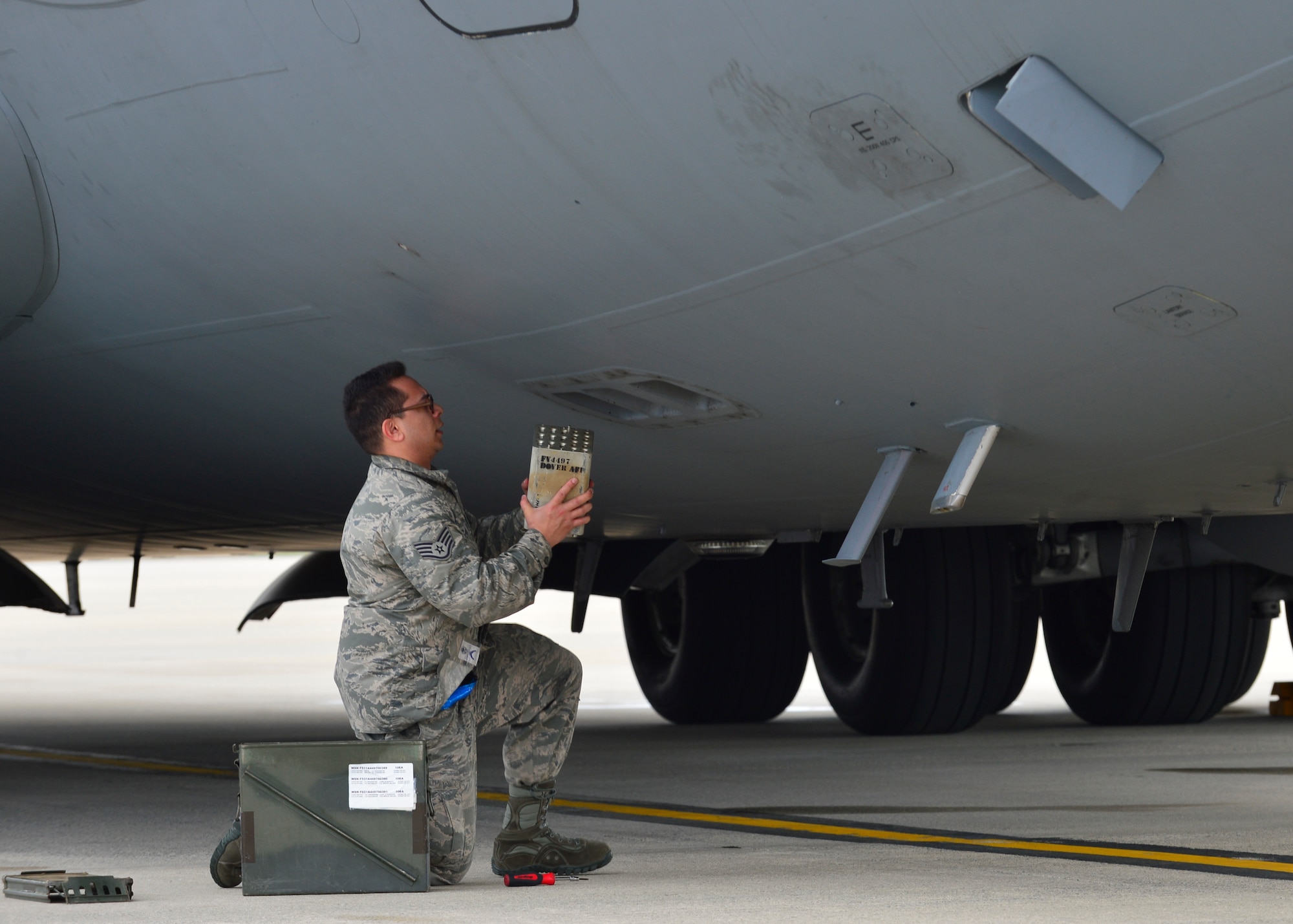 Staff Sgt. Matthew Calvo, a 736th Aircraft Maintenance Squadron communication, countermeasure and navigation system craftsman, uploads a flare magazine onto a C-17A Globemaster III on March 25, 2016, at Dover Air Force Base, Del. Each magazine consists of different flare sticks that are capable of defeating different infrared threats. (U.S. Air Force photo/Senior Airman William Johnson)