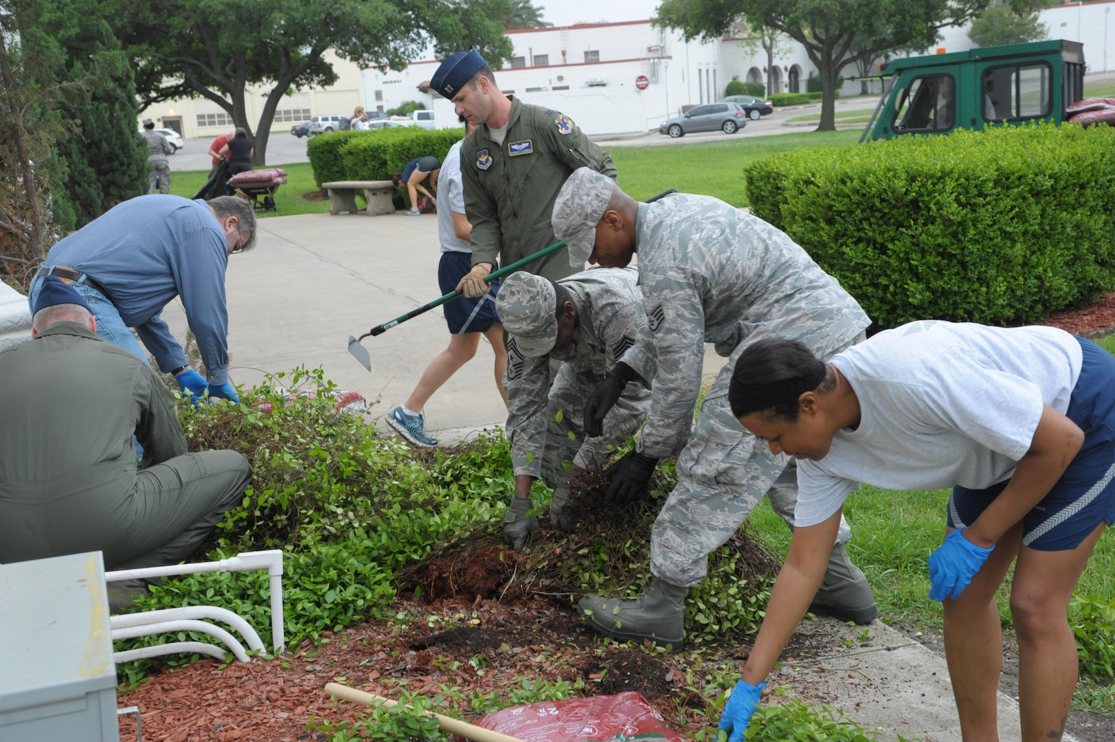 Members from the 12th Flying Training Wing and the 502nd Security Forces Logistic Support Group do garden work at the Taj, April 8, 2015 during Joint Base San Antonio Pride Week at JBSA-Randolph.  Team JBSA will join forces with other JBSA mission partners to improve the appearance of our installation. (U.S. Air Force photo by Joel Martinez/Released)