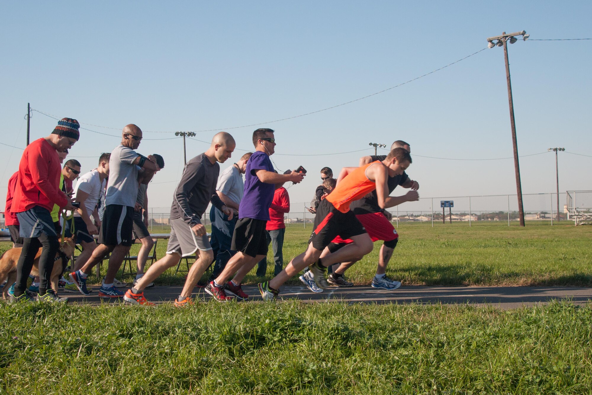 On your marks! Get set! Go! Runners take off at the beginning of the 307th Bomb Wing Family Day 5K on Barksdale Air Force Base, La. on April 2, 2016. During the family day, reservists and their families were able to compete for Olympic style medals while also enjoying a picnic. (U.S. Air Force photo by Master Sgt. Dachelle Melville/Released)